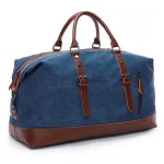 Grand sac de voyage vintage en toile et cuir bleu Grand sac de voyage vintage en toile et cuir, pratique et résistant bleu présentation de face