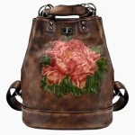 Sac à dos pour femme en cuir vintage style rétro avec motif floral café Sac à dos pour femme en cuir vintage style rétro avec motif floral café