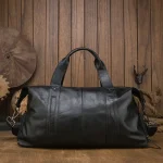 Sac de voyage en cuir noir verso Sac de voyage en cuir noir verso